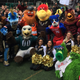 A group of mascots pose for a photo on the Friends Select school’s roof.